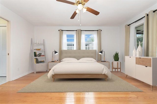 1432 Meadowlark Dr, Deltona, FL 32725 - bedroom with light wood-style floors, ceiling fan, and baseboards
