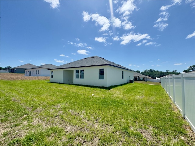 back of property with stucco siding