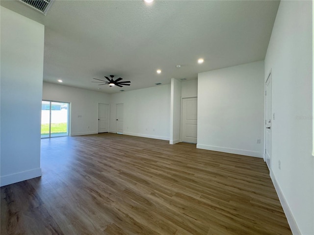 unfurnished room with ceiling fan, baseboards, wood finished floors, and recessed lighting