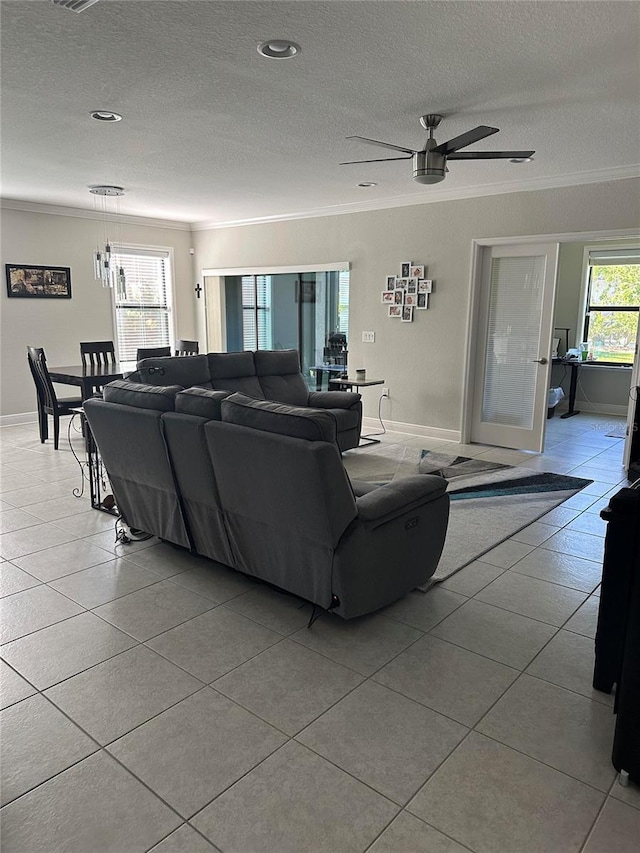 2137 Apian Way, Port Charlotte, FL 33953 - tiled living area with a textured ceiling, ceiling fan, crown molding, and baseboards