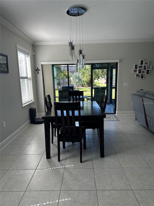 2137 Apian Way, Port Charlotte, FL 33953 - dining area featuring ornamental molding, light tile patterned floors, baseboards, and a textured ceiling
