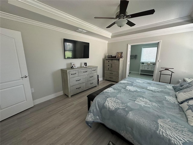 2137 Apian Way, Port Charlotte, FL 33953 - bedroom with a raised ceiling, wood finished floors, ornamental molding, baseboards, and a ceiling fan