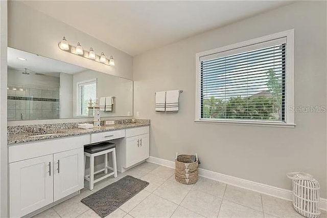 2137 Apian Way, Port Charlotte, FL 33953 - full bathroom featuring baseboards, a shower stall, double vanity, and tile patterned floors