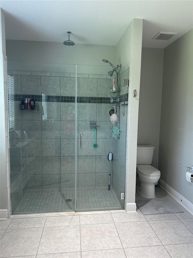 2137 Apian Way, Port Charlotte, FL 33953 - bathroom with a stall shower, toilet, baseboards, and tile patterned floors