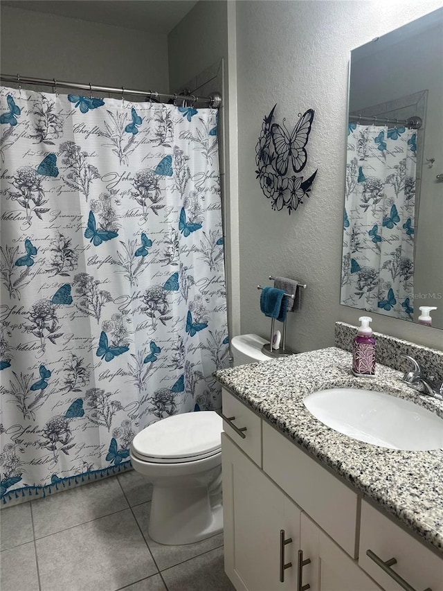 2137 Apian Way, Port Charlotte, FL 33953 - full bath with toilet, vanity, tile patterned flooring, a textured wall, and a shower with shower curtain