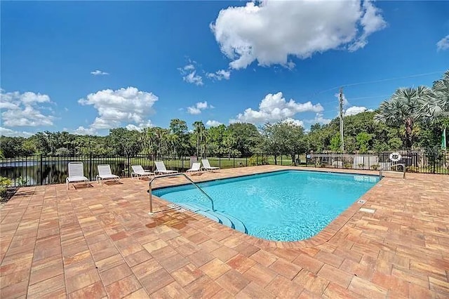 2137 Apian Way, Port Charlotte, FL 33953 - community pool with a patio, fence, and view of wooded area