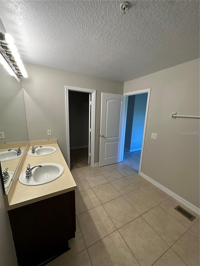 2125 Betsy Ross Ln, Saint Cloud, FL 34769 - bathroom with tile patterned floors, a sink, and visible vents