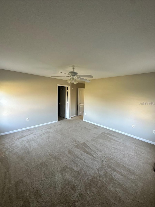 2125 Betsy Ross Ln, Saint Cloud, FL 34769 - carpeted spare room with baseboards and ceiling fan