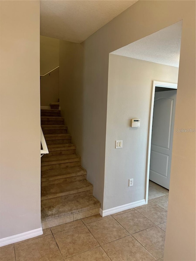 2125 Betsy Ross Ln, Saint Cloud, FL 34769 - stairway with baseboards and tile patterned flooring