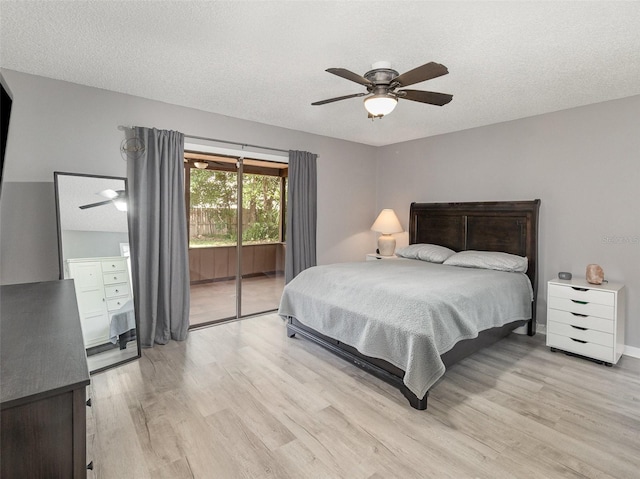490 Burnt Tree Ln, Apopka, FL 32712 - bedroom featuring a textured ceiling, a ceiling fan, light wood-style flooring, and access to exterior