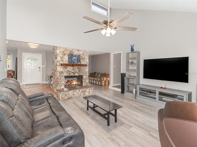 490 Burnt Tree Ln, Apopka, FL 32712 - living area with a fireplace, high vaulted ceiling, a ceiling fan, baseboards, and wood finished floors