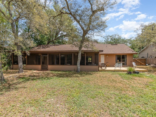490 Burnt Tree Ln, Apopka, FL 32712 - rear view of property featuring a yard, a deck, fence, and a sunroom