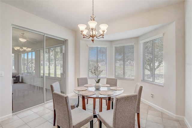 1900 NW 57th Ct, Ocala, FL 34482 - dining room with a chandelier, light tile patterned flooring, and baseboards