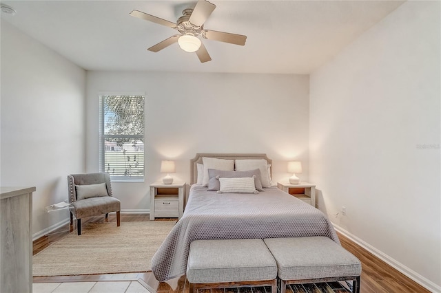 1900 NW 57th Ct, Ocala, FL 34482 - bedroom featuring baseboards, a ceiling fan, and wood finished floors