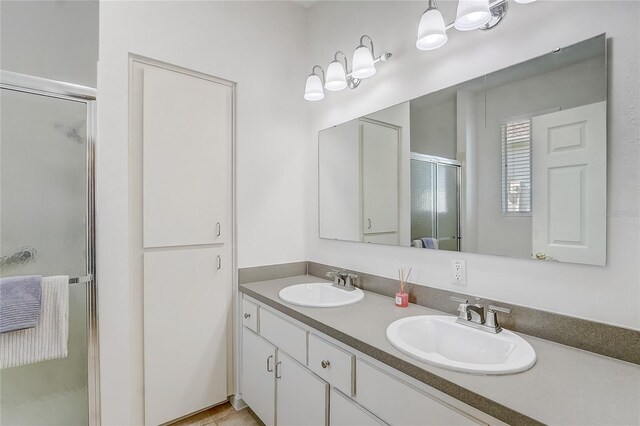 1900 NW 57th Ct, Ocala, FL 34482 - bathroom with a stall shower and double vanity