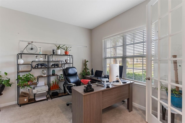 office area with light carpet, french doors, and baseboards