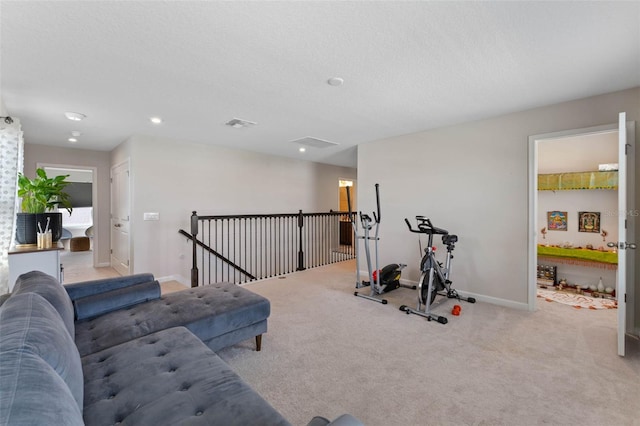 exercise room with baseboards, recessed lighting, carpet flooring, and a textured ceiling