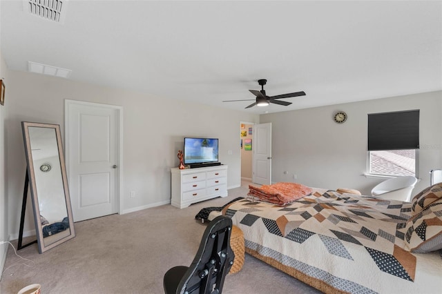 bedroom featuring carpet flooring, visible vents, baseboards, and a ceiling fan