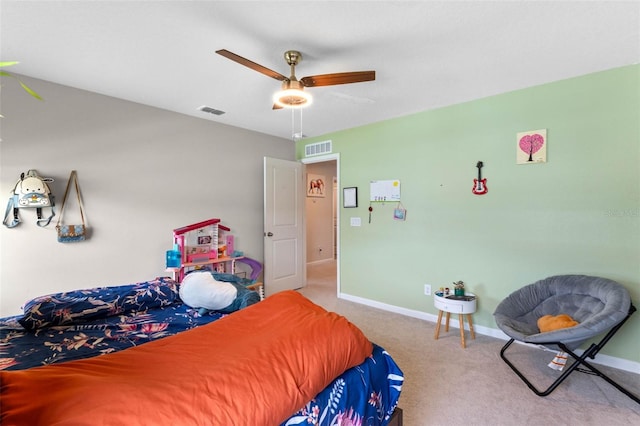 carpeted bedroom with visible vents, baseboards, and ceiling fan