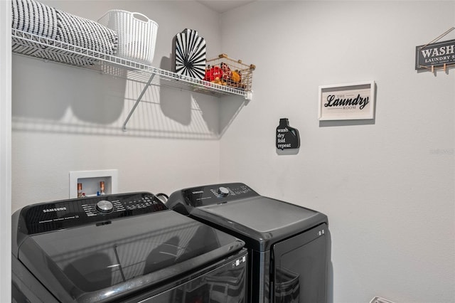 laundry area featuring washing machine and dryer and laundry area