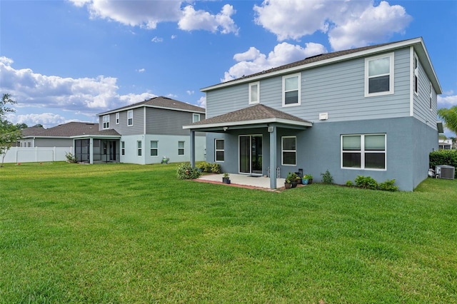back of property featuring a yard, central air condition unit, stucco siding, and a patio area