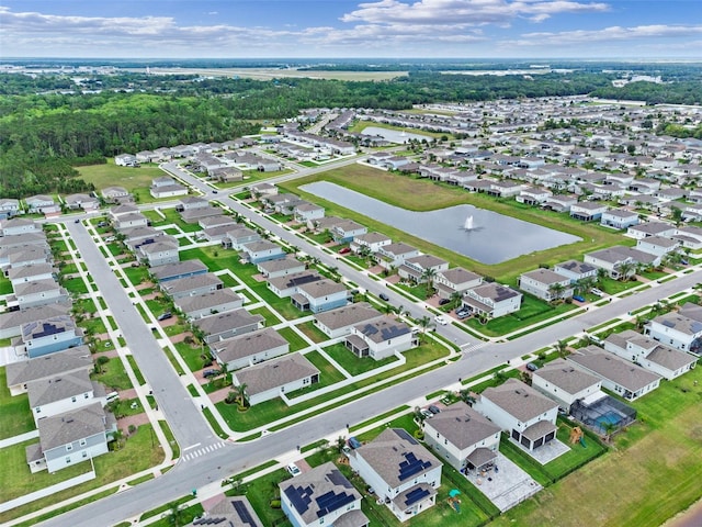 birds eye view of property featuring a water view and a residential view