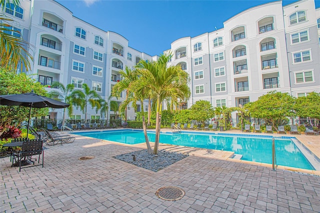 204 E S St Unit 2061, Orlando, FL 32801 - community pool featuring a patio and fence