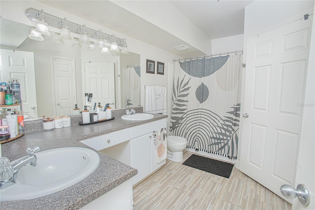 204 E S St Unit 2061, Orlando, FL 32801 - bathroom featuring double vanity, a sink, curtained shower, and toilet