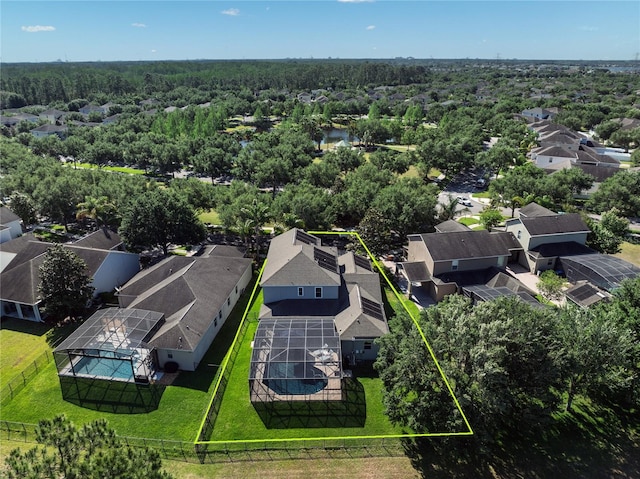aerial perspective of suburban area featuring property parcel outlined and a forest