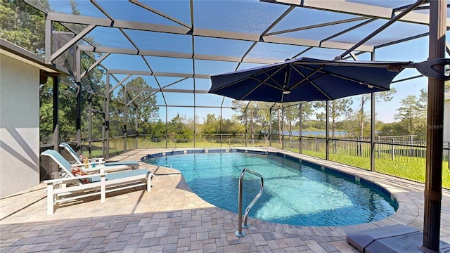 view of swimming pool featuring glass enclosure, a patio area, and fence