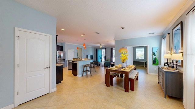 dining area featuring crown molding, baseboards, recessed lighting, and light tile patterned floors