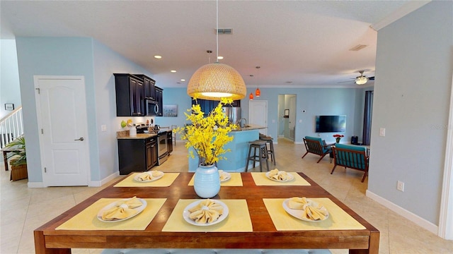 dining area with light tile patterned floors, recessed lighting, baseboards, and ceiling fan