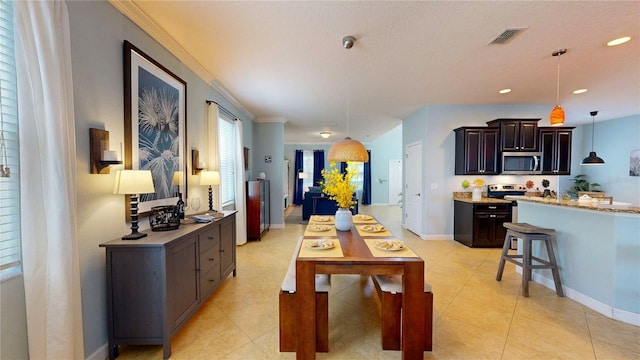 dining area featuring light tile patterned flooring, baseboards, and recessed lighting