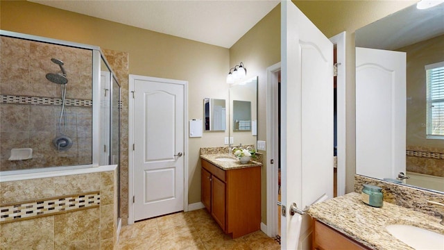 bathroom featuring a stall shower, vanity, and tile patterned floors