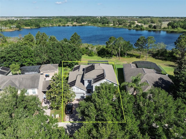 aerial view of residential area with property parcel outlined and a nearby body of water