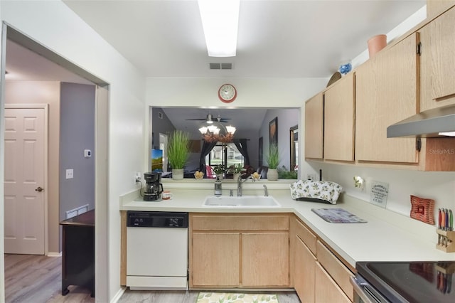 kitchen featuring visible vents, light brown cabinetry, white dishwasher, light countertops, and a sink