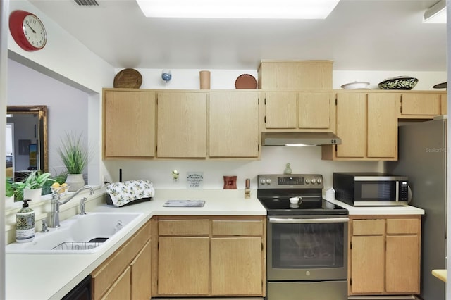 kitchen with a sink, light brown cabinets, light countertops, stainless steel appliances, and under cabinet range hood