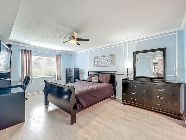 1150 Carmel Cir Unit 301, Casselberry, FL 32707 - bedroom featuring light wood-style flooring, ceiling fan, baseboards, and ornamental molding