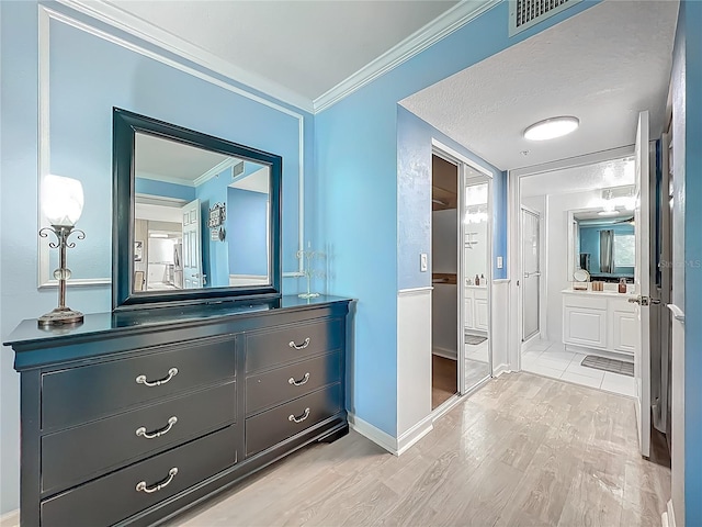 1150 Carmel Cir Unit 301, Casselberry, FL 32707 - full bathroom with vanity, a stall shower, crown molding, visible vents, and wood finished floors