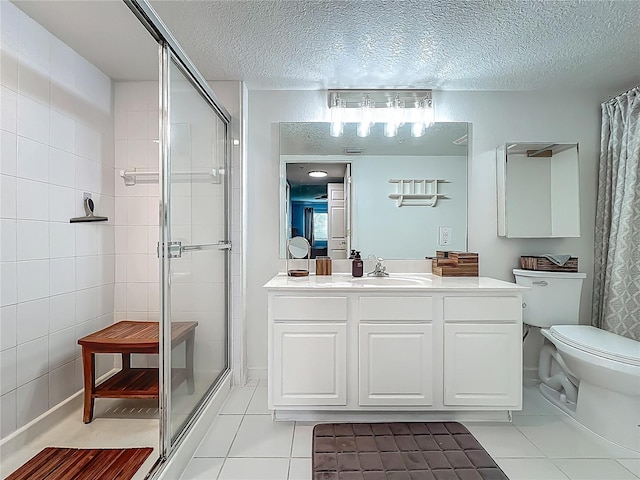 1150 Carmel Cir Unit 301, Casselberry, FL 32707 - bathroom featuring a shower stall, a textured ceiling, vanity, toilet, and tile patterned floors