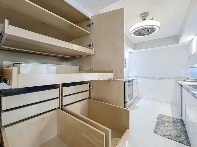 1150 Carmel Cir Unit 301, Casselberry, FL 32707 - interior space with stainless steel electric stove and open shelves