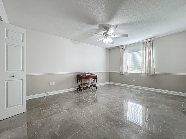 1150 Carmel Cir Unit 301, Casselberry, FL 32707 - unfurnished room with baseboards, ceiling fan, and a textured ceiling