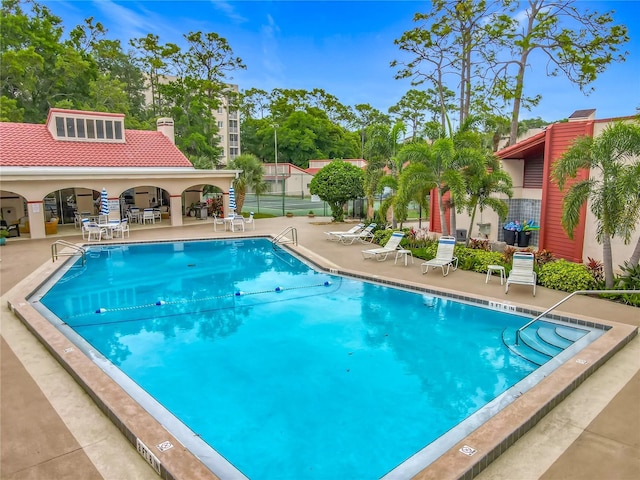 1150 Carmel Cir Unit 301, Casselberry, FL 32707 - pool with a patio area and fence