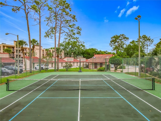 1150 Carmel Cir Unit 301, Casselberry, FL 32707 - view of tennis court with community basketball court, fence, and a residential view