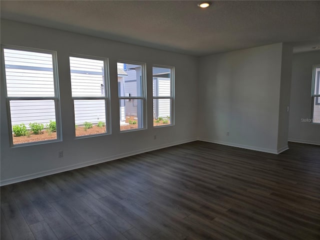 2980 Embark Trl, Saint Cloud, FL 34771 - unfurnished room with baseboards and dark wood finished floors