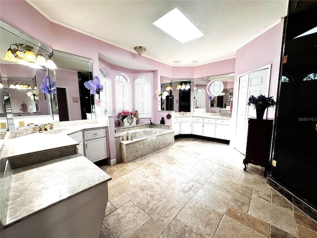 8935 Jonathan Manor Dr, Orlando, FL 32819 - full bath with two vanities, crown molding, stone tile flooring, a bath, and a sink