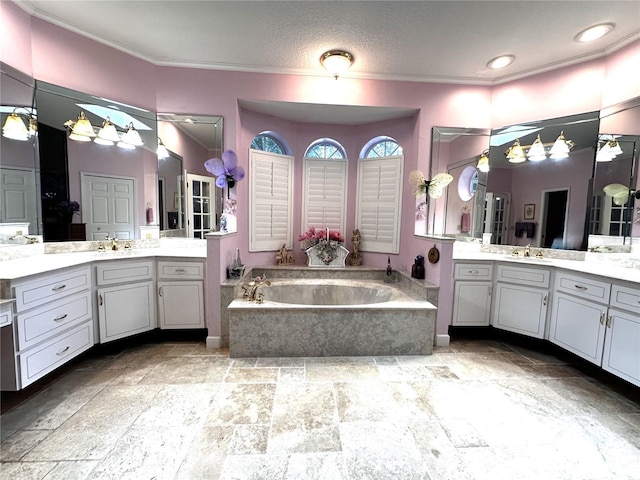 8935 Jonathan Manor Dr, Orlando, FL 32819 - full bathroom featuring crown molding, a garden tub, vanity, and stone tile flooring