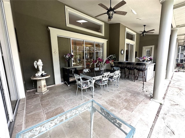 8935 Jonathan Manor Dr, Orlando, FL 32819 - view of patio / terrace with outdoor dining space, ceiling fan, and outdoor dry bar