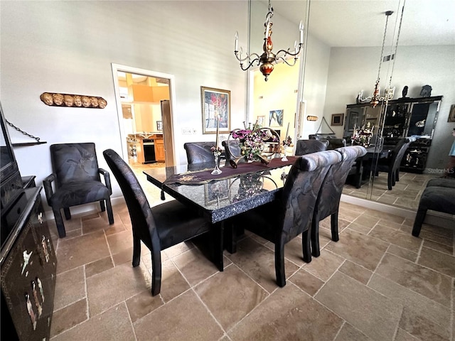 8935 Jonathan Manor Dr, Orlando, FL 32819 - dining area with an inviting chandelier, stone tile floors, and a towering ceiling