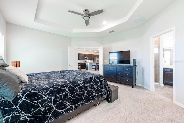 4231 Swan St, Haines City, FL 33844 - bedroom featuring a tray ceiling, light colored carpet, a ceiling fan, visible vents, and baseboards